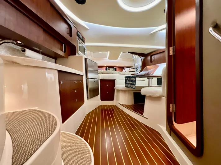  Yacht Photos Pics Luxurious interior of 2016 Grady-White Express 370 boat with wood accents and modern amenities.