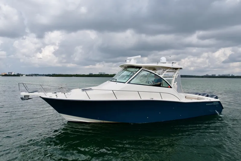  Yacht Photos Pics 2016 Grady-White Express 370 boat on water under cloudy sky.