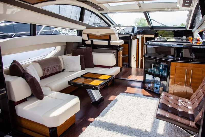  Yacht Photos Pics Luxurious interior of 2009 Marquis 500 Sport Coupe yacht with modern furnishings and elegant design.