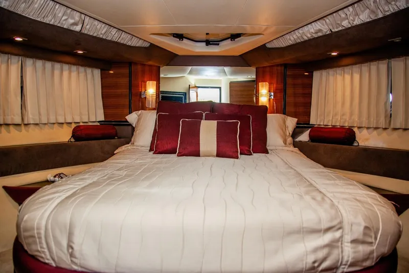  Yacht Photos Pics Luxurious bedroom interior of 2009 Marquis 500 Sport Coupe yacht.