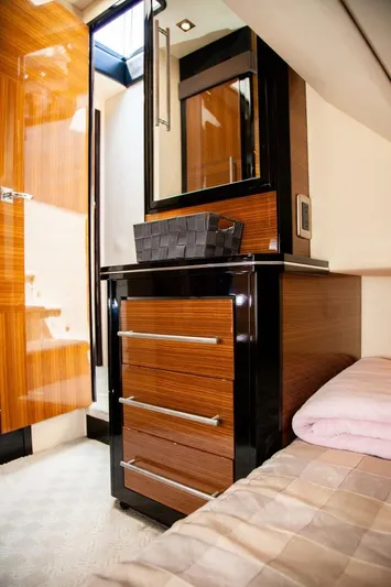  Yacht Photos Pics Luxurious interior of 2009 Marquis 500 Sport Coupe with sleek wooden cabinetry and modern design.