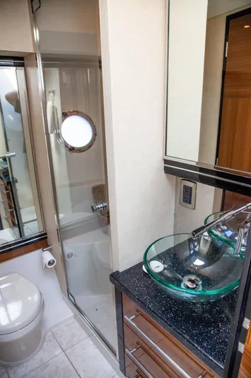  Yacht Photos Pics Luxurious bathroom in 2009 Marquis 500 Sport Coupe yacht with glass sink and shower.