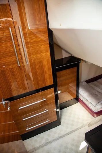  Yacht Photos Pics Interior of 2009 Marquis 500 Sport Coupe with sleek wood cabinetry and cozy sleeping area.