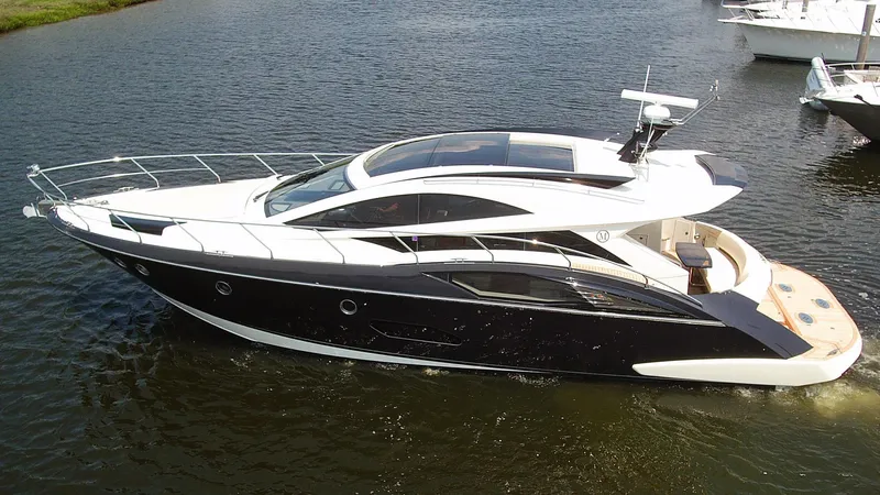  Yacht Photos Pics 2009 Marquis 500 Sport Coupe yacht cruising on calm waters.