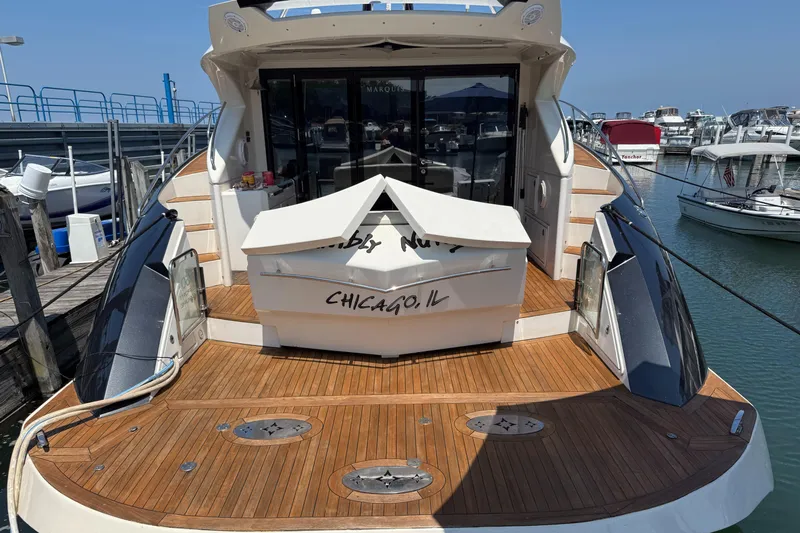  Yacht Photos Pics 2009 Marquis 500 Sport Coupe yacht docked, featuring teak deck and Chicago, IL registration.