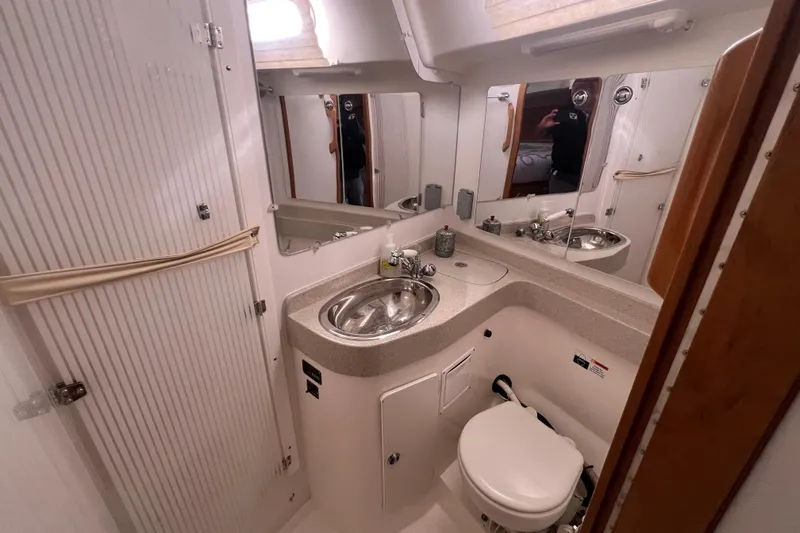  Yacht Photos Pics Bathroom interior of a 2007 Catalina 42 MkII yacht with sink and toilet.