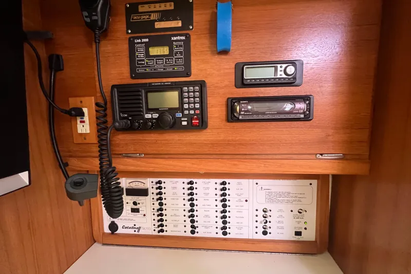  Yacht Photos Pics Control panel of a 2007 Catalina 42 MkII yacht with communication and audio equipment.
