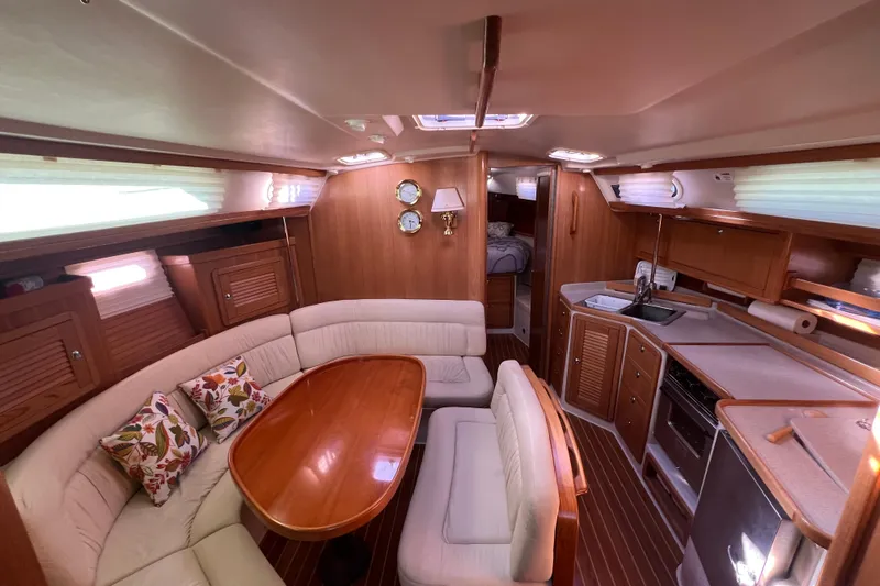  Yacht Photos Pics Luxurious interior of a 2007 Catalina 42 MkII yacht with elegant wood finishes.