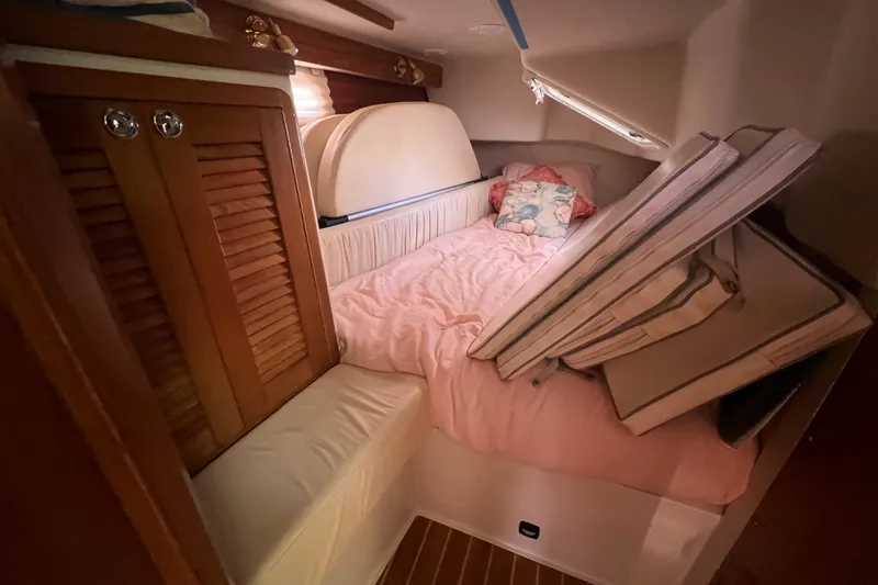  Yacht Photos Pics Cozy cabin interior of 2007 Catalina 42 MkII sailboat with bed and storage.