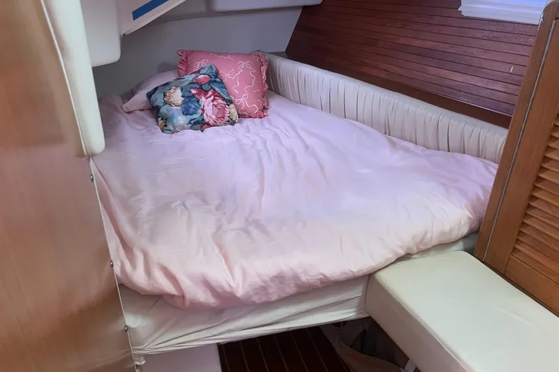  Yacht Photos Pics Cozy cabin bed with pink bedding in a 2007 Catalina 42 MkII sailboat.