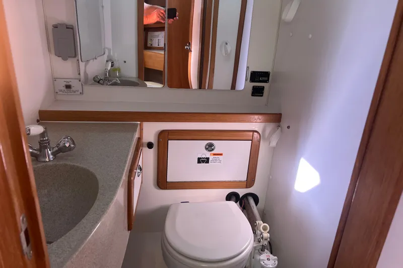  Yacht Photos Pics Bathroom interior of 2007 Catalina 42 MkII yacht, featuring sink and toilet.