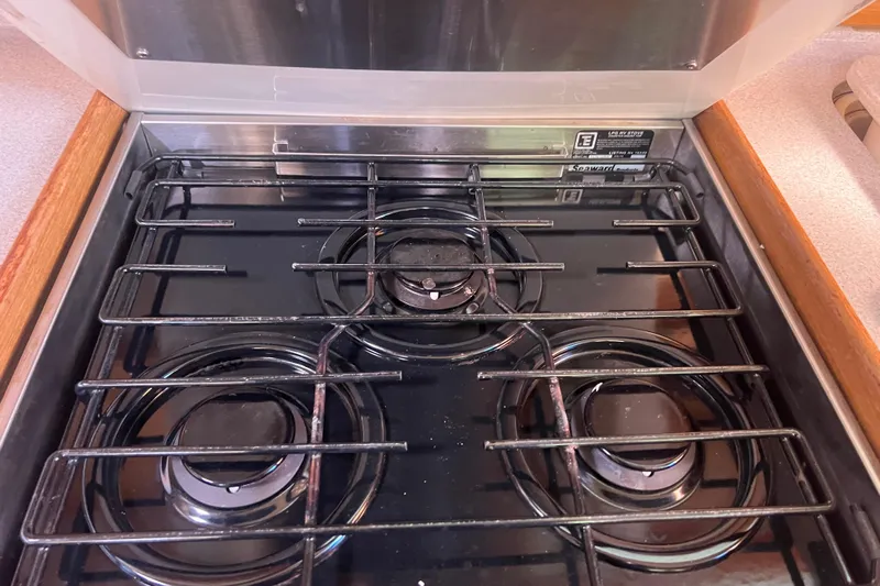  Yacht Photos Pics Stove in 2007 Catalina 42 MkII yacht kitchen, featuring three burners.