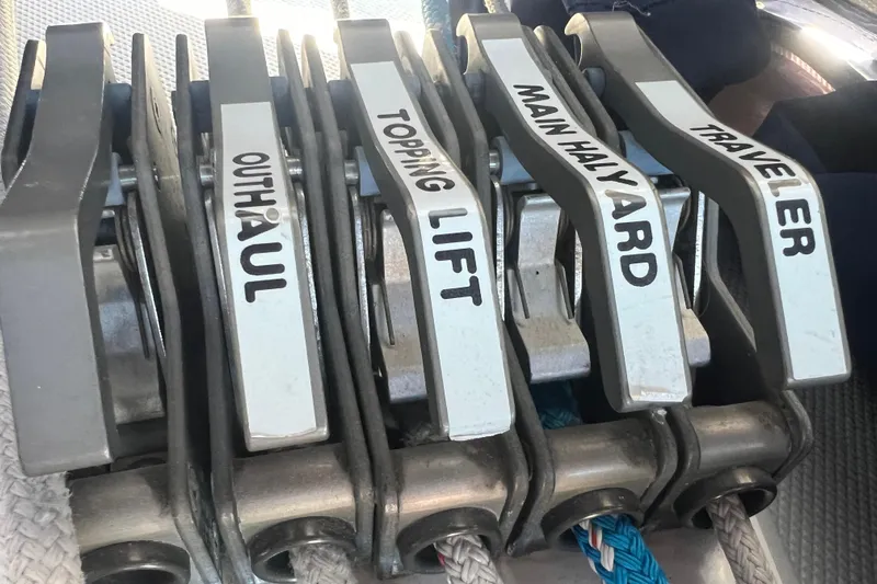  Yacht Photos Pics Sailboat control levers labeled outhaul, topping lift, main halyard, traveler on Catalina 42 MkII, 2007.