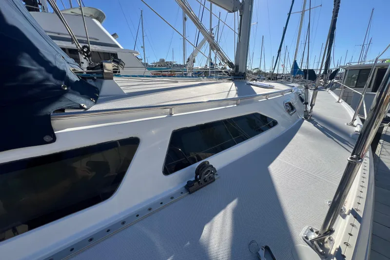  Yacht Photos Pics 2007 Catalina 42 MkII sailboat deck view in marina, showcasing sleek design and rigging.