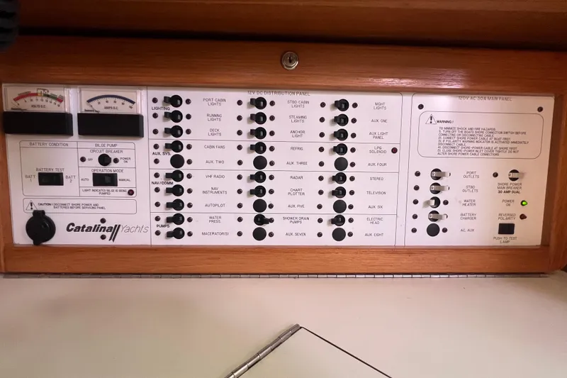  Yacht Photos Pics Control panel of a 2007 Catalina 42 MkII yacht with various switches and gauges.