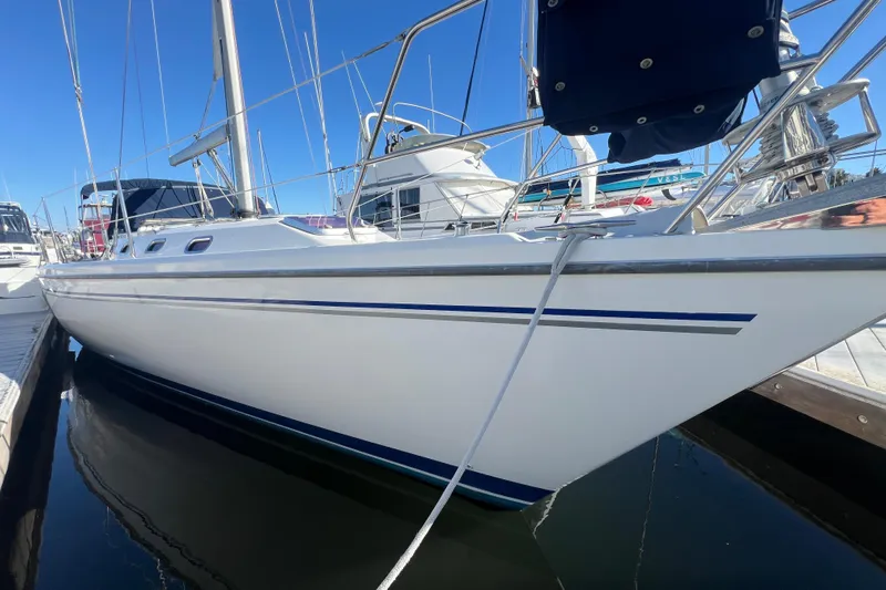  Yacht Photos Pics 2007 Catalina 42 MkII sailboat docked, showcasing sleek white hull and blue accents.