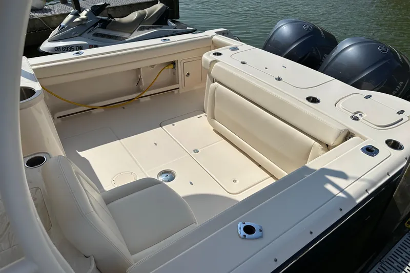 Yacht Photos Pics 2016 Grady-White Freedom 307 boat interior with seating and dual outboard motors.