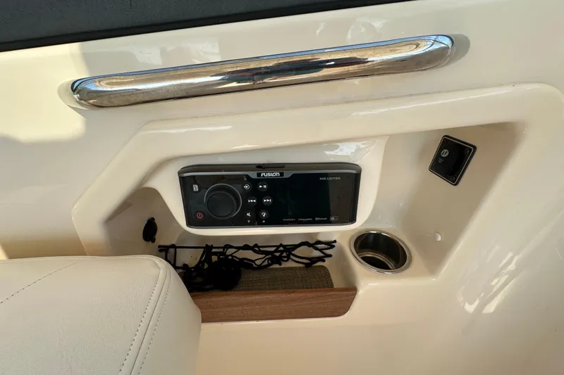  Yacht Photos Pics 2016 Grady-White Freedom 307 boat console with Fusion stereo system and cup holder.