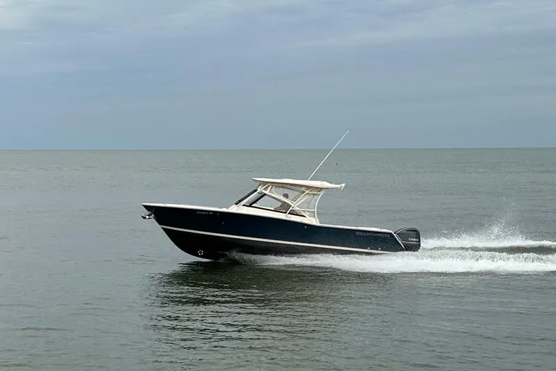  Yacht Photos Pics 2016 Grady-White Freedom 307 boat cruising on open water.