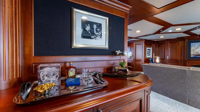 Focus Yacht Photos Pics Luxurious interior of 2002 North American Tri-Deck Motor Yacht with elegant wood paneling and bar setup.