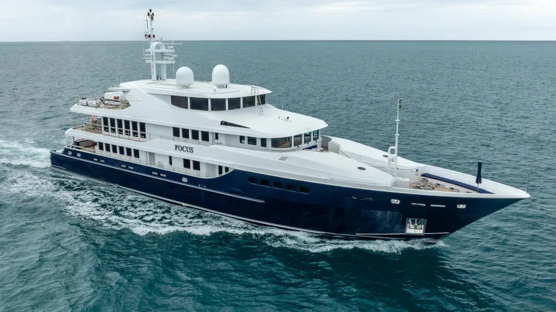 Focus Yacht Photos Pics Luxurious 2002 North American Tri-Deck Motor Yacht cruising on open sea.