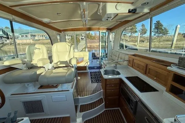 Someday Soon Yacht Photos Pics Interior of a 2015 Back Cove 37 yacht with modern seating and kitchen area.