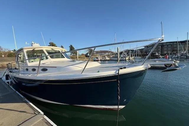 Someday Soon Yacht Photos Pics 2015 Back Cove 37 yacht docked in marina under clear blue sky.