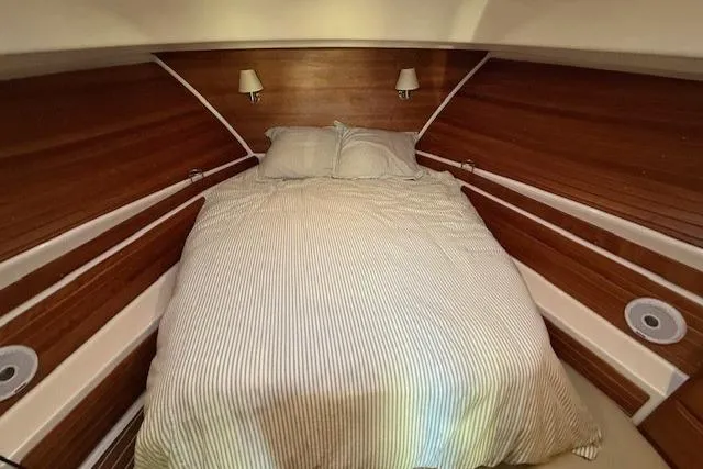 Someday Soon Yacht Photos Pics 2015 Back Cove 37 yacht cabin with cozy bed and wooden interior.