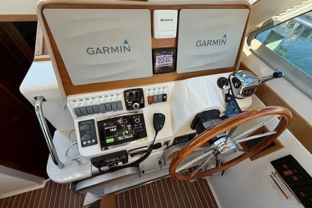 Someday Soon Yacht Photos Pics Helm of 2015 Back Cove 37 with Garmin navigation and wooden steering wheel.