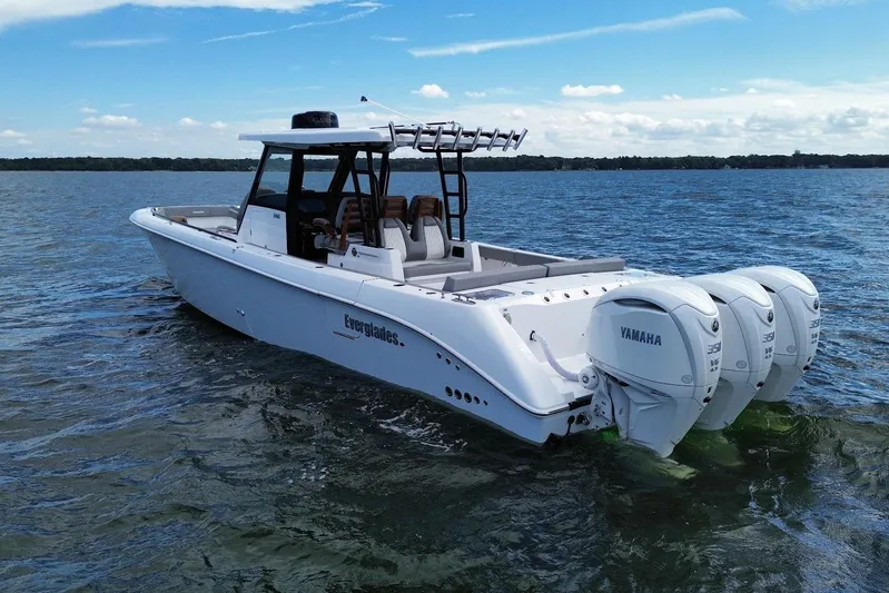  Yacht Photos Pics 2026 Everglades 375 Center Console boat with triple Yamaha engines on open water.
