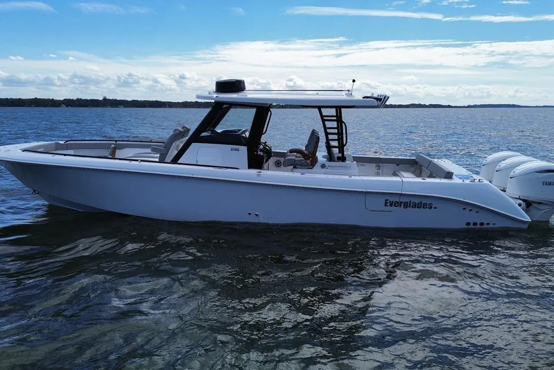  Yacht Photos Pics 2026 Everglades 375 Center Console boat on calm water under a blue sky.