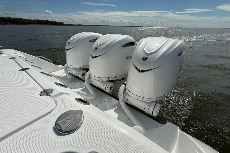  Yacht Photos Pics 2026 Everglades 375 Center Console with triple outboard engines on open water.