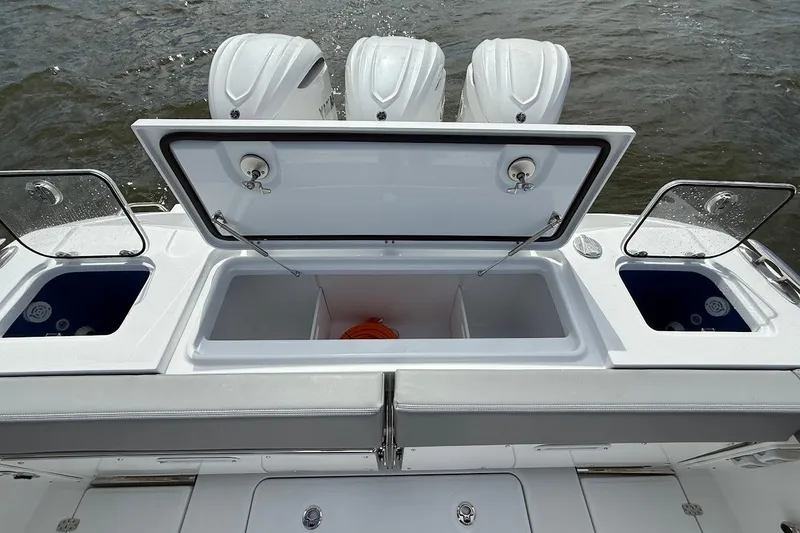  Yacht Photos Pics 2026 Everglades 375 Center Console boat with open storage compartments and triple engines.