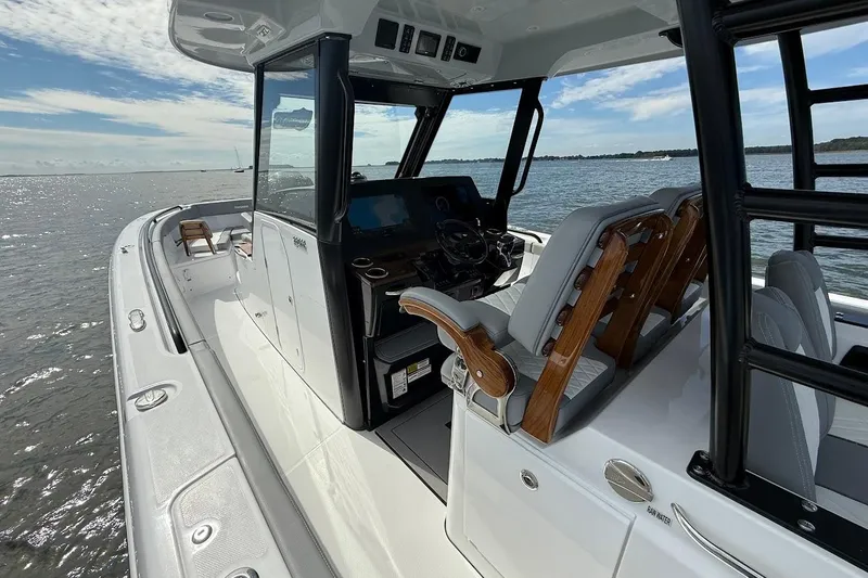  Yacht Photos Pics 2026 Everglades 375 Center Console boat on water, featuring sleek design and modern helm.