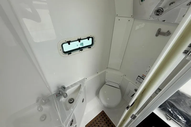  Yacht Photos Pics Interior of 2026 Everglades 375 Center Console boat bathroom with sink and toilet.