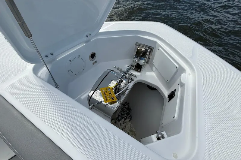  Yacht Photos Pics Anchor compartment of 2026 Everglades 375 Center Console boat, open lid, ocean background.