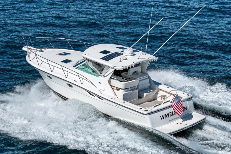 Wave Length Yacht Photos Pics 2001 Tiara Yachts 3500 Open cruising on ocean, displaying American flag.