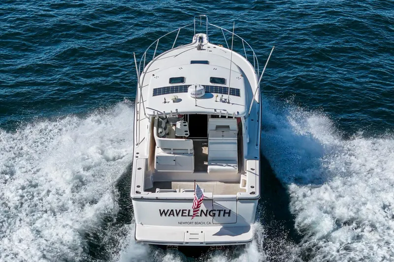 Wave Length Yacht Photos Pics 2001 Tiara Yachts 3500 Open cruising on the ocean, rear view.