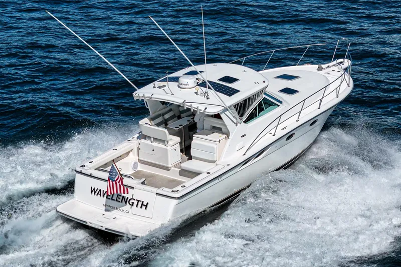 Wave Length Yacht Photos Pics 2001 Tiara Yachts 3500 Open cruising on the ocean, rear view with American flag.