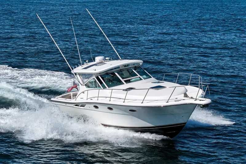 Wave Length Yacht Photos Pics 2001 Tiara Yachts 3500 Open cruising on the ocean, showcasing sleek design and performance.