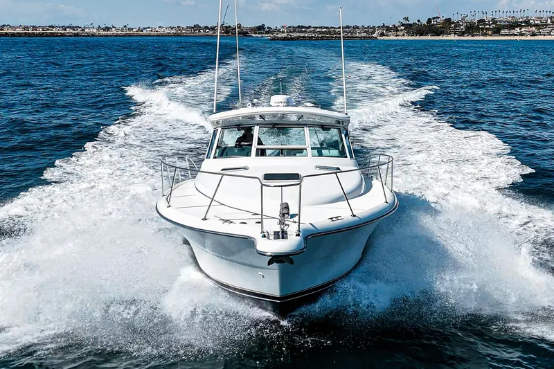 Wave Length Yacht Photos Pics 2001 Tiara Yachts 3500 Open cruising on open water, creating a dynamic wake.