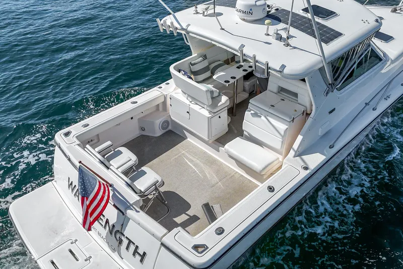 Wave Length Yacht Photos Pics 2001 Tiara Yachts 3500 Open cruising on water, rear view with American flag.