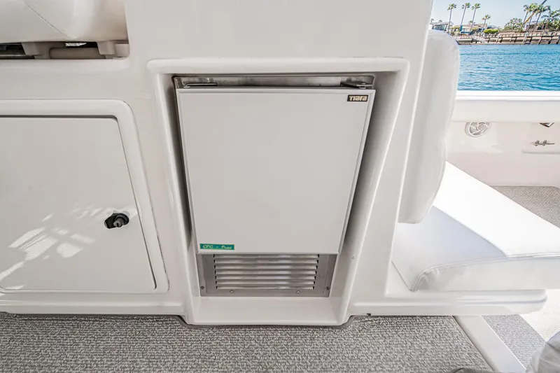 Wave Length Yacht Photos Pics 2001 Tiara Yachts 3500 Open interior with built-in refrigerator, dockside view.