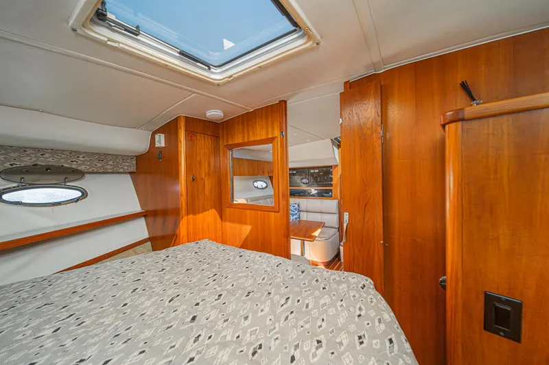 Wave Length Yacht Photos Pics Interior of 2001 Tiara Yachts 3500 Open, featuring wood paneling and a skylight.