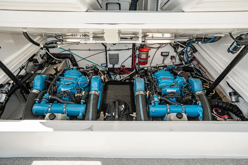 Wave Length Yacht Photos Pics Engine compartment of 2001 Tiara Yachts 3500 Open, featuring dual blue engines and wiring.