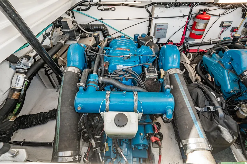 Wave Length Yacht Photos Pics Engine compartment of a 2001 Tiara Yachts 3500 Open, featuring a blue marine engine.