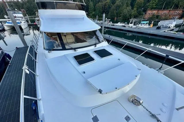 Topcat Yacht Photos Pics Luxury Aspen C120 yacht docked at marina, 2022 model, sleek design, scenic background.