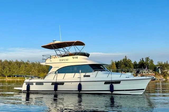 Topcat Yacht Photos Pics 2022 Aspen C120 yacht on calm water with scenic background.