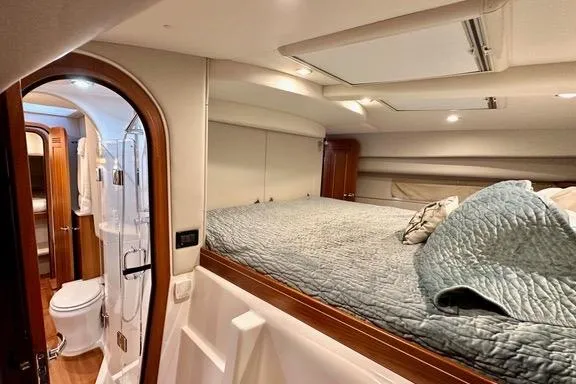 Topcat Yacht Photos Pics Luxurious Aspen C120 2022 yacht interior with cozy bed and modern bathroom.