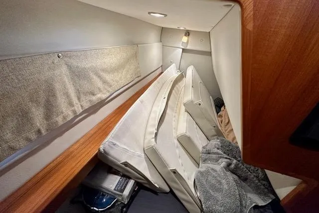 Topcat Yacht Photos Pics 2022 Aspen C120 cabin interior with cushions and storage space.